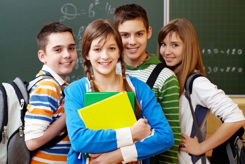 Happy students in class